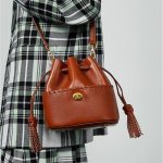 Brown drawstring bucket bag sample for custom handbag manufacturing review